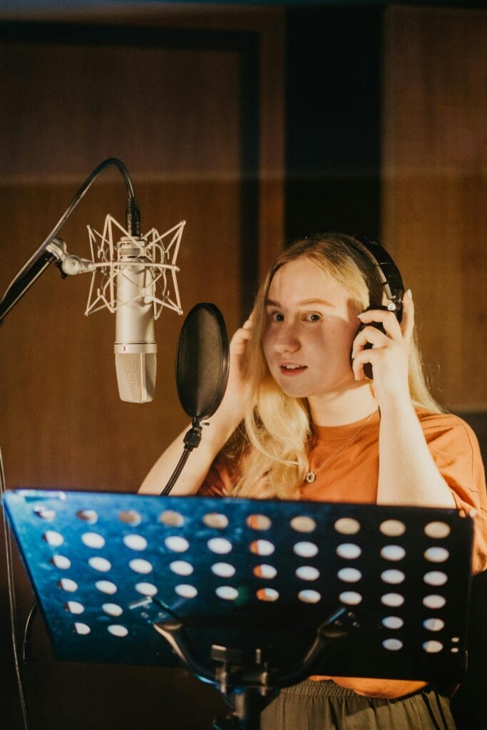 A Woman Inside a Recording Studio Best Microphones For Streaming And Gaming